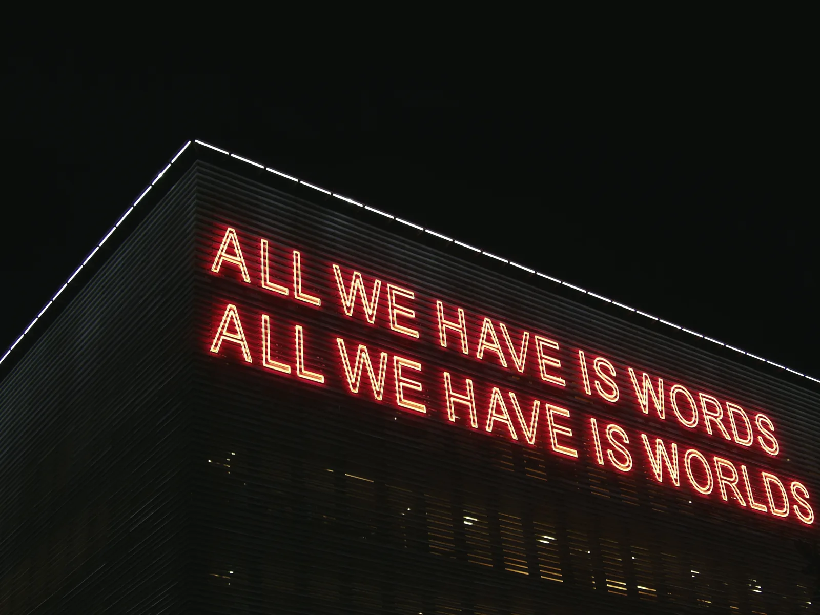 Enseigne au néon : all we have is words, all we have is worlds